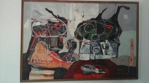 TWO FIGURES AT TABLE